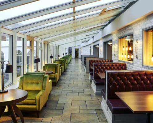 Conservatory dining area in stylish hotel